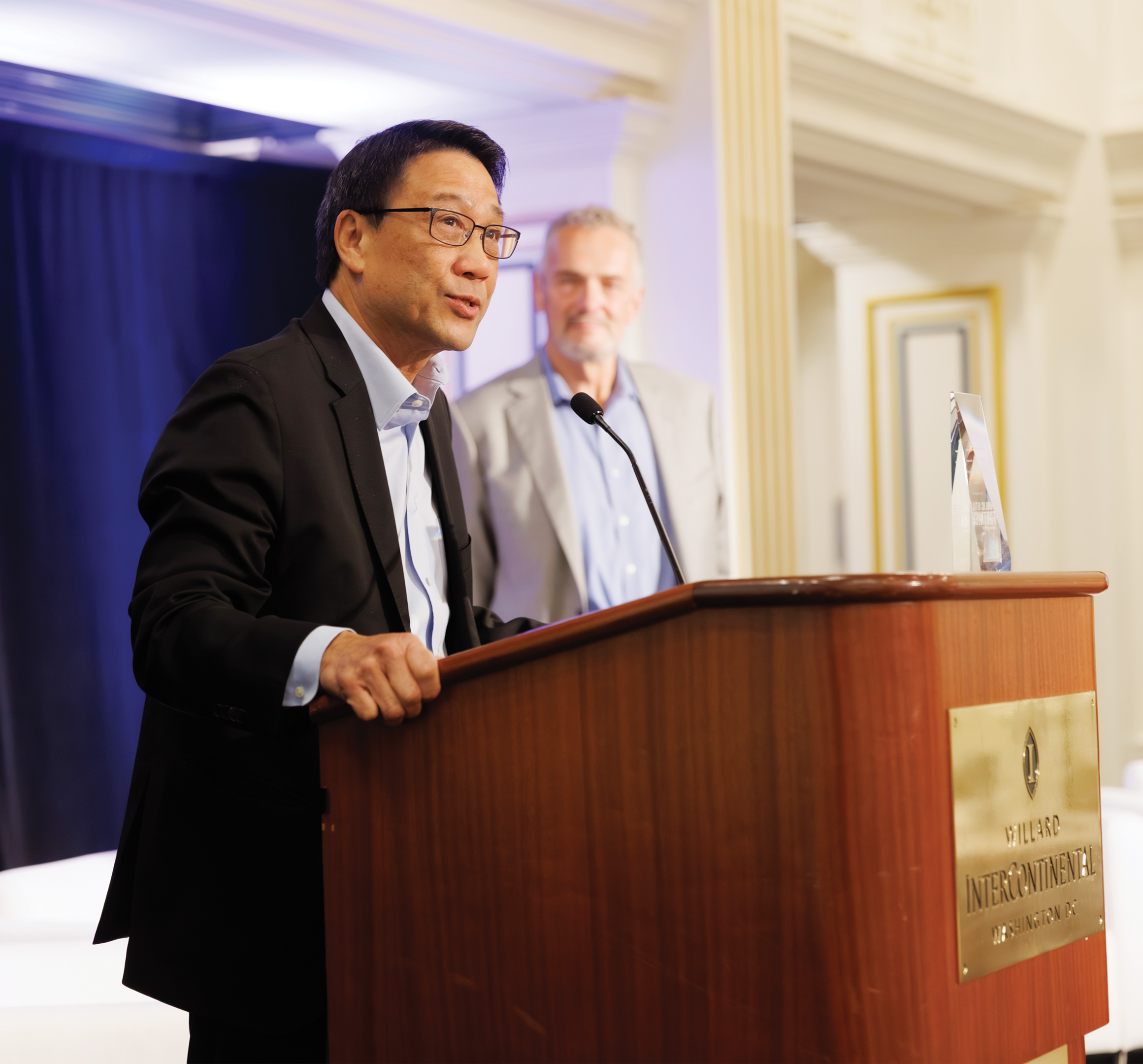 Keynote speaker Paul Lau at podium